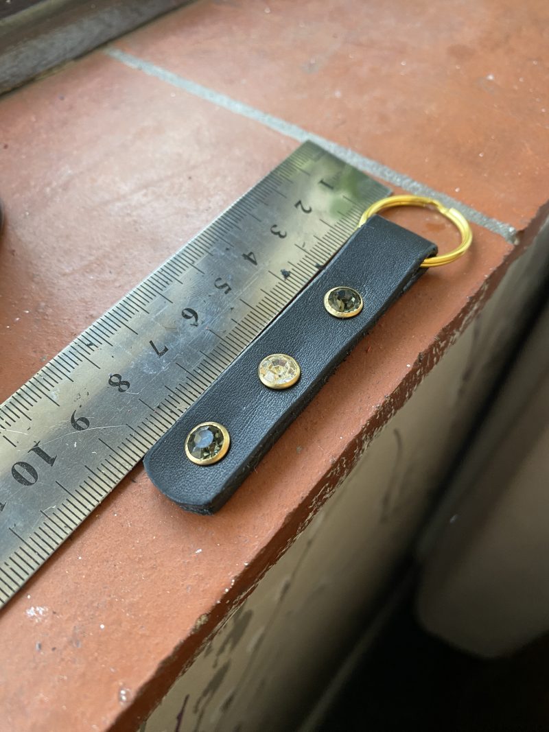 Green and white crystal and leather keyring