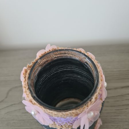Upcycled glass jar. Wrapped with dark grey yarn and pink flowers