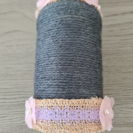 Upcycled glass jar. Wrapped with dark grey yarn and pink flowers