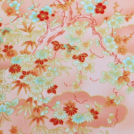 Detail of pale orange cushion cover with Japanese cherry blossom design and deeper orange cloud pattern, 18 inch with zip