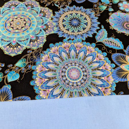 Lining detail of blue mandala floral cushion cover with intricate circular patterns on a black background, 45cm square decorative pillow case