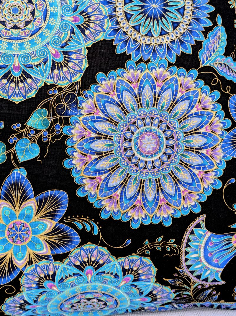 Reverse detail of blue mandala floral cushion cover with intricate circular patterns on a black background, 45cm square decorative pillow case