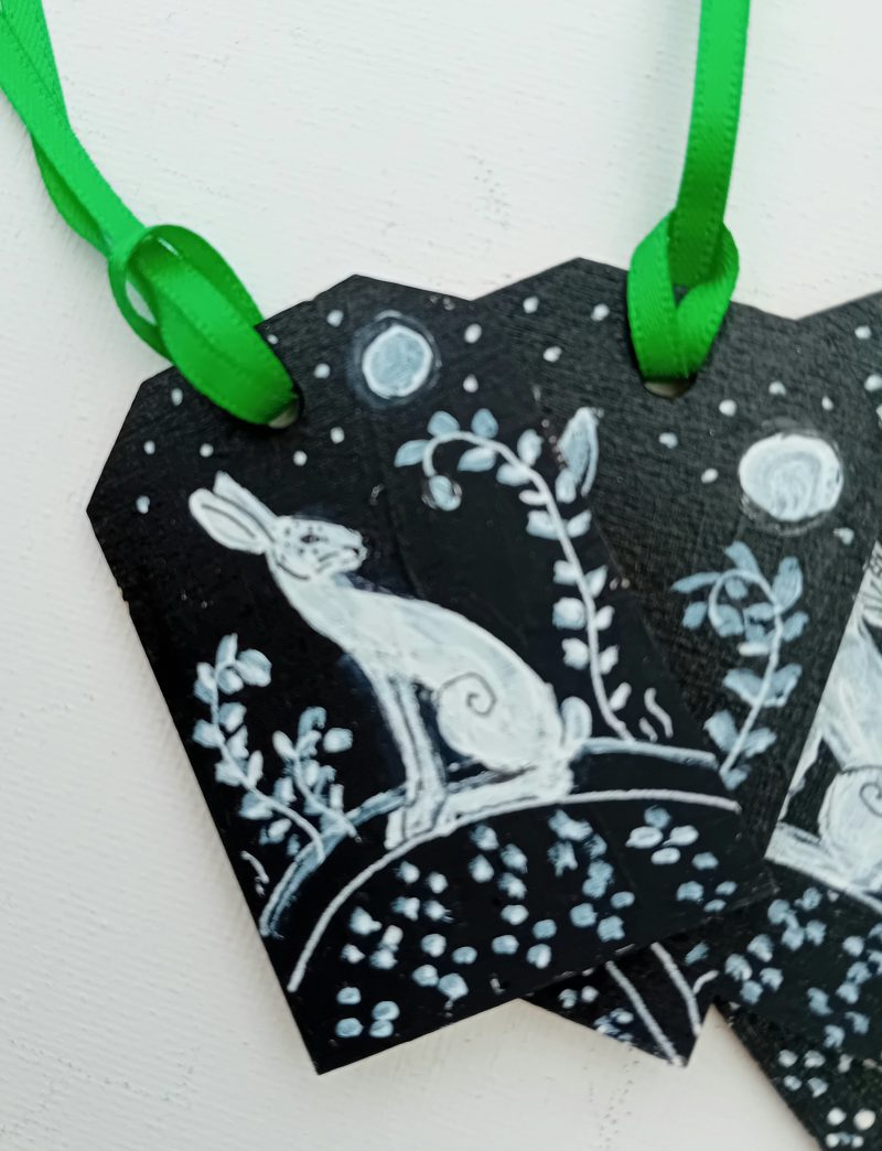 hand painted special set of 4 gift tags white hares on black background in moonlight green ribbons