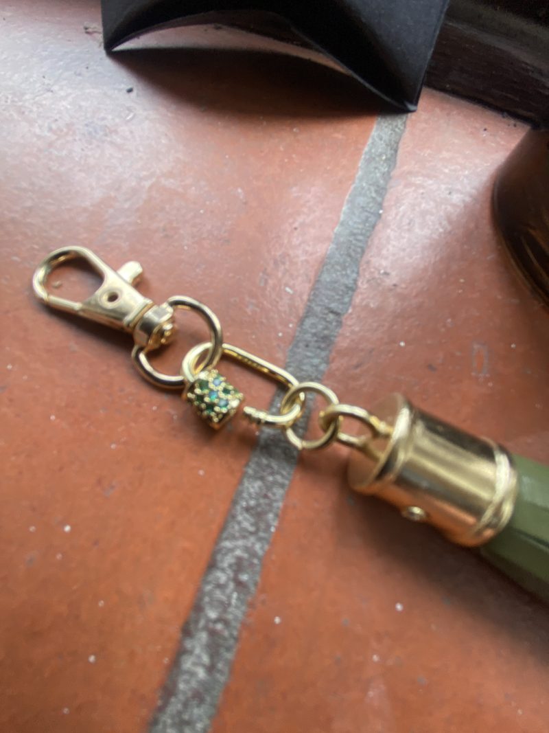 Absolutely stunning bag charm or keyring brass and cubic zaconia imbelishment