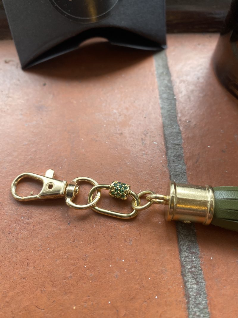 Absolutely stunning bag charm or keyring brass and cubic zaconia imbelishment