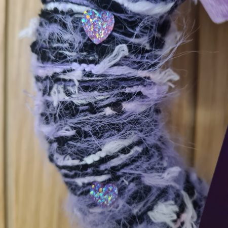 Lilac & pink yarn wrapped wreath with a velvet bow and crystal hearts