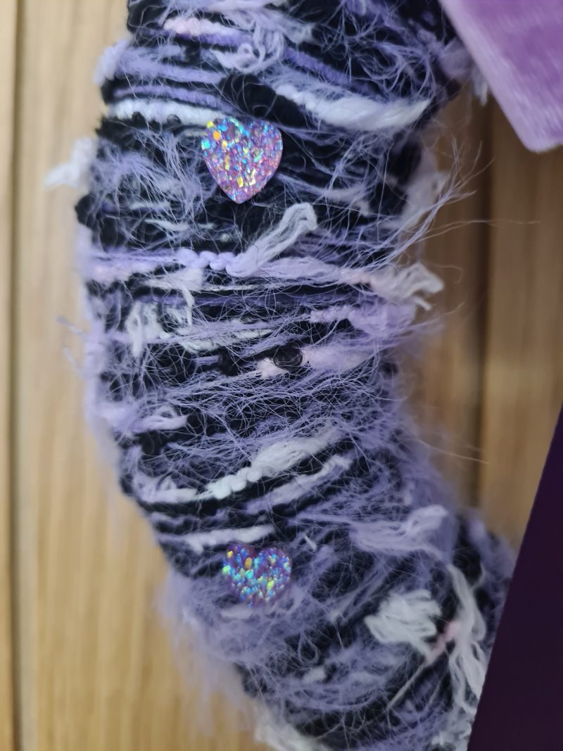 Lilac & pink yarn wrapped wreath with a velvet bow and crystal hearts