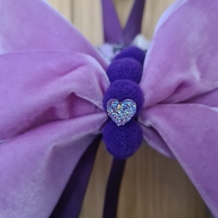 Lilac & pink yarn wrapped wreath with a velvet bow and crystal hearts