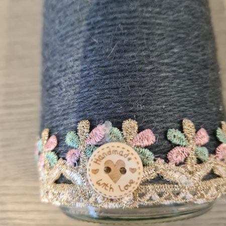 Upcycled glass jar wrapped in dark grey yarn with lace and jute trim