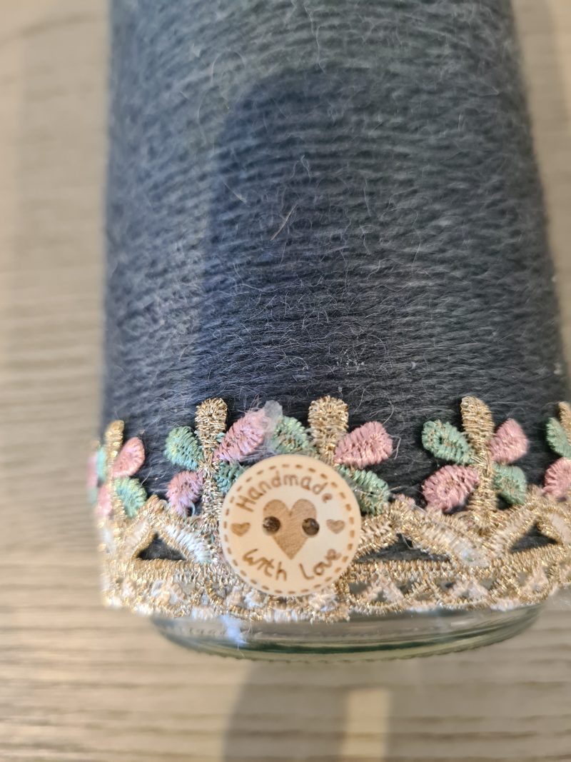 Upcycled glass jar wrapped in dark grey yarn with lace and jute trim