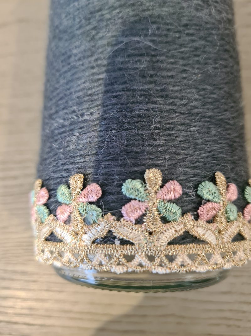Upcycled glass jar wrapped in dark grey yarn with lace and jute trim