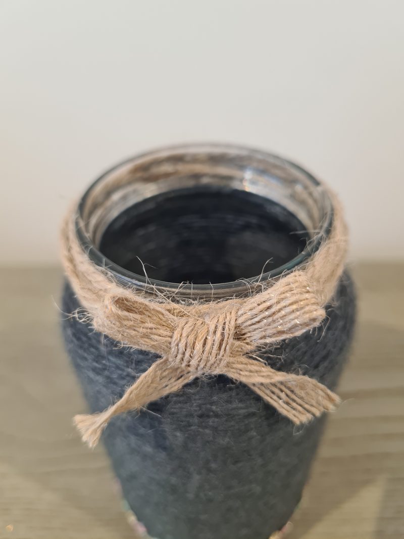 Upcycled glass jar wrapped in dark grey yarn with lace and jute trim