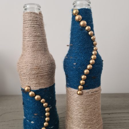Set of 2 upcycled glass bottles Wrapped with jute and teal yarn
