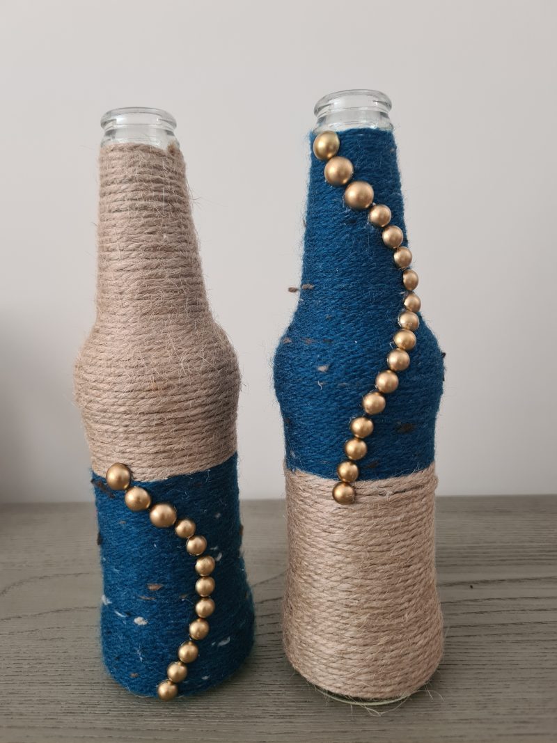 Set of 2 upcycled glass bottles Wrapped with jute and teal yarn
