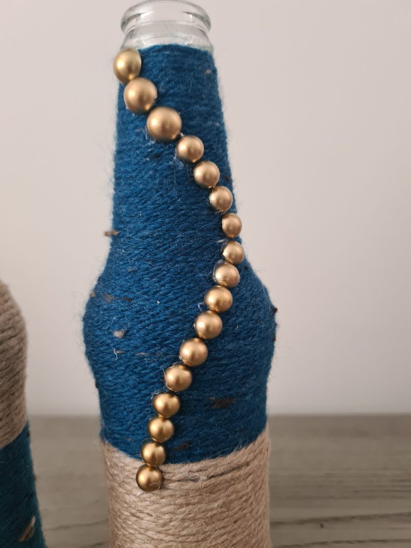 Set of 2 upcycled glass bottles Wrapped with jute and teal yarn