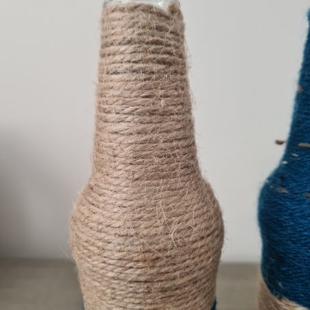 Set of 2 upcycled glass bottles Wrapped with jute and teal yarn