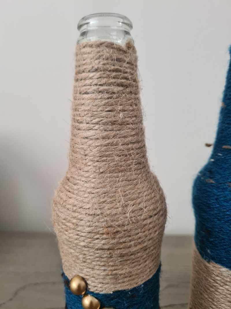 Set of 2 upcycled glass bottles Wrapped with jute and teal yarn