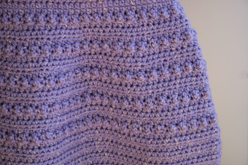Bobble pattern on skirt part of crochet pinafore style dress