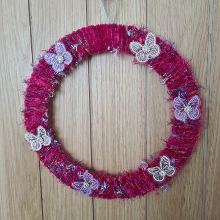 Vibrant pink yarn wrapped wreath