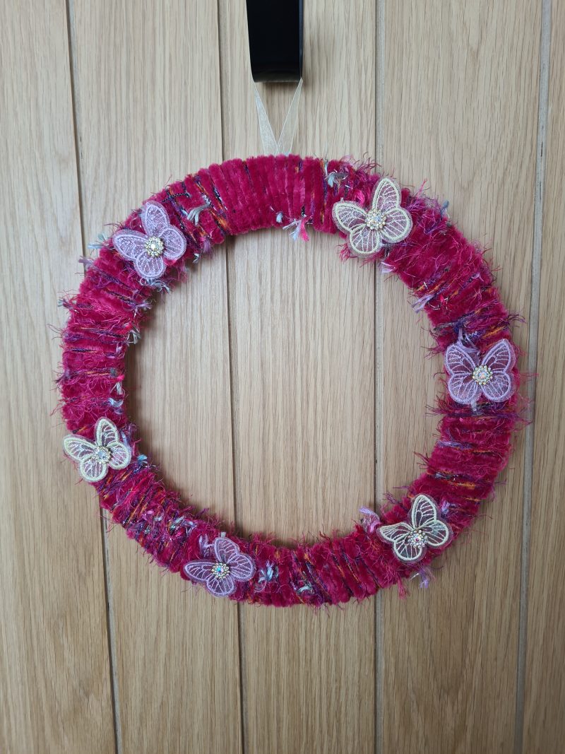 Vibrant pink yarn wrapped wreath