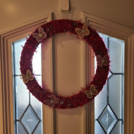 Vibrant pink yarn wrapped wreath