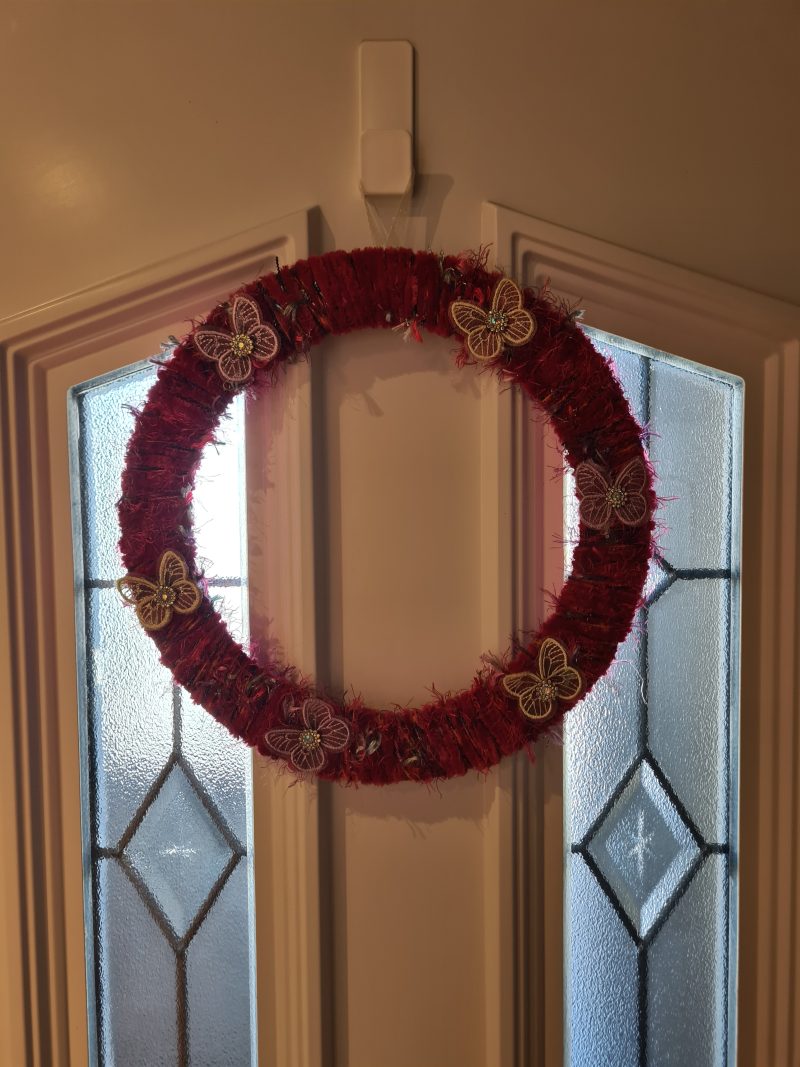 Vibrant pink yarn wrapped wreath