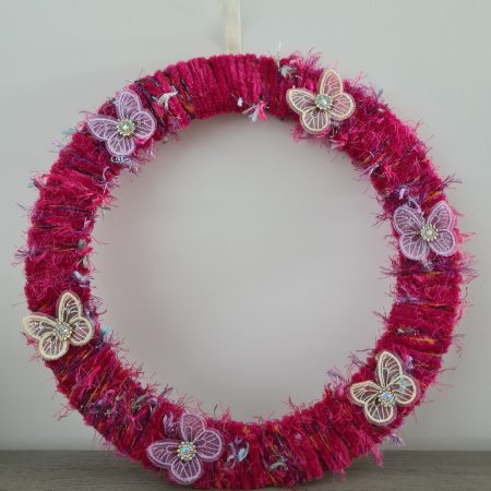 Vibrant pink yarn wrapped wreath