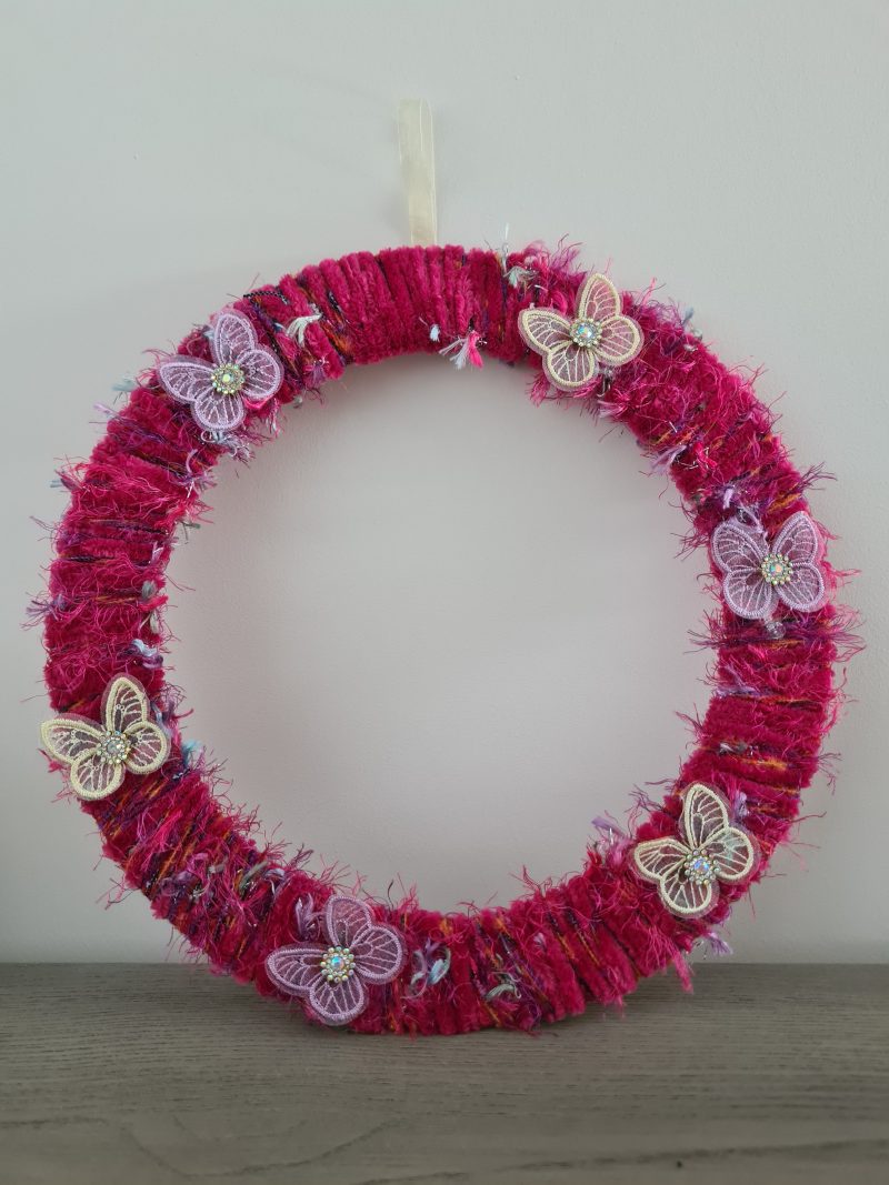 Vibrant pink yarn wrapped wreath
