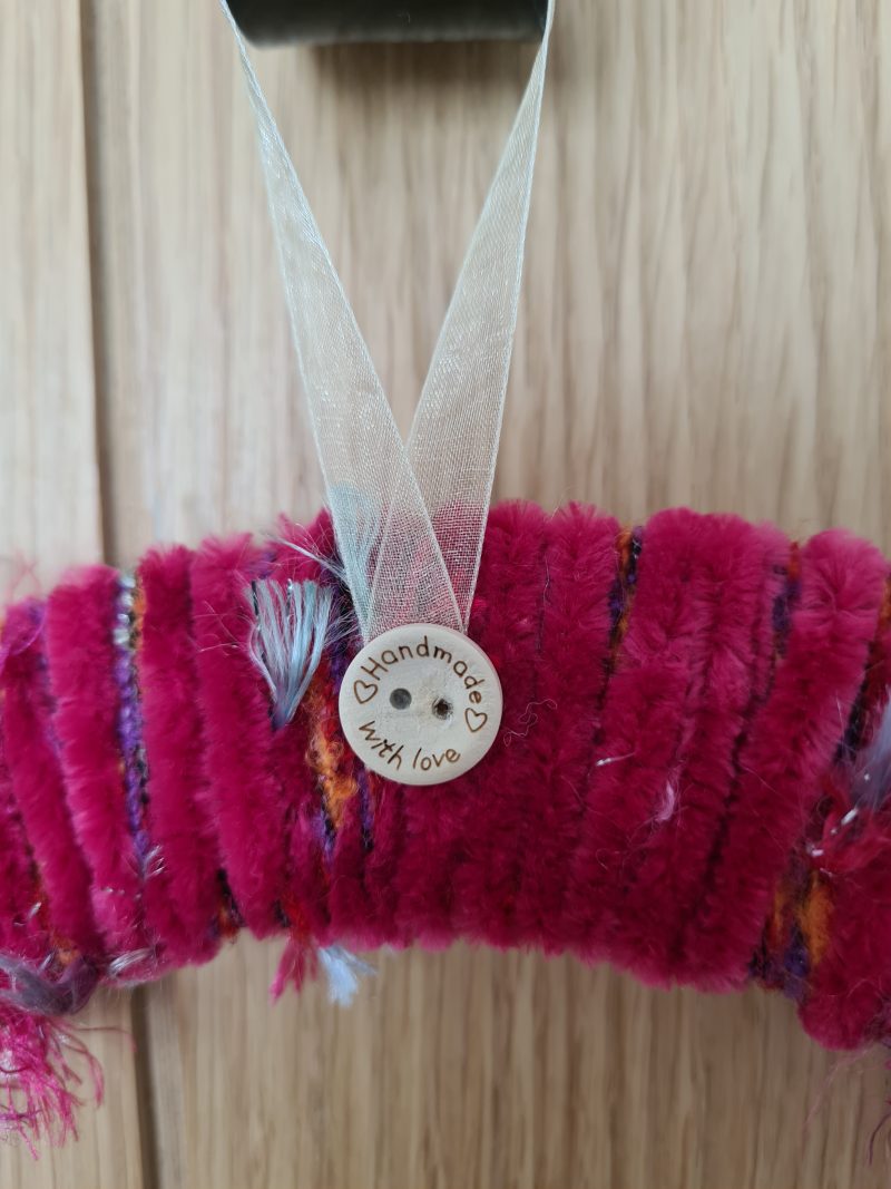 Vibrant pink yarn wrapped wreath