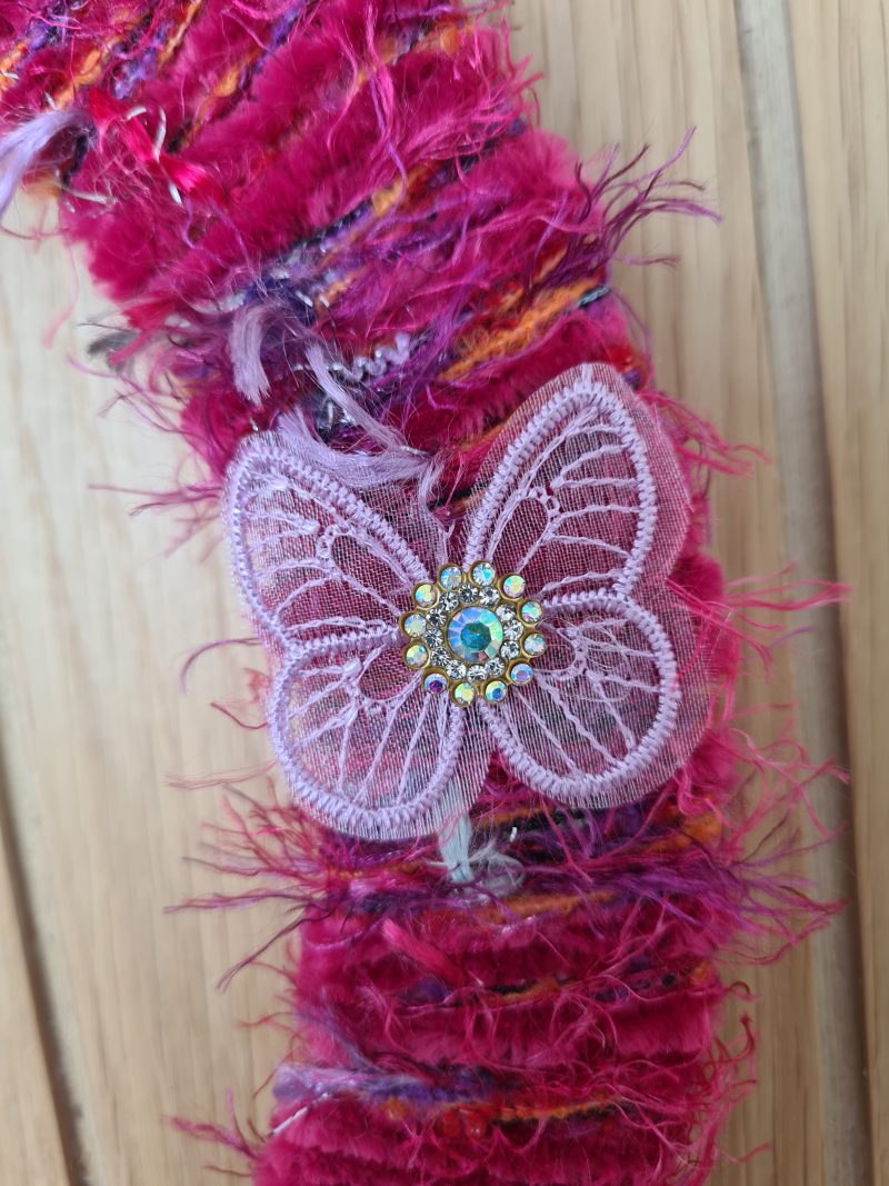 Vibrant pink yarn wrapped wreath