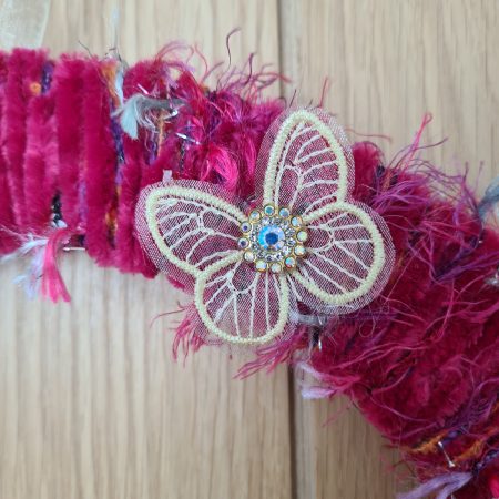 Vibrant pink yarn wrapped wreath