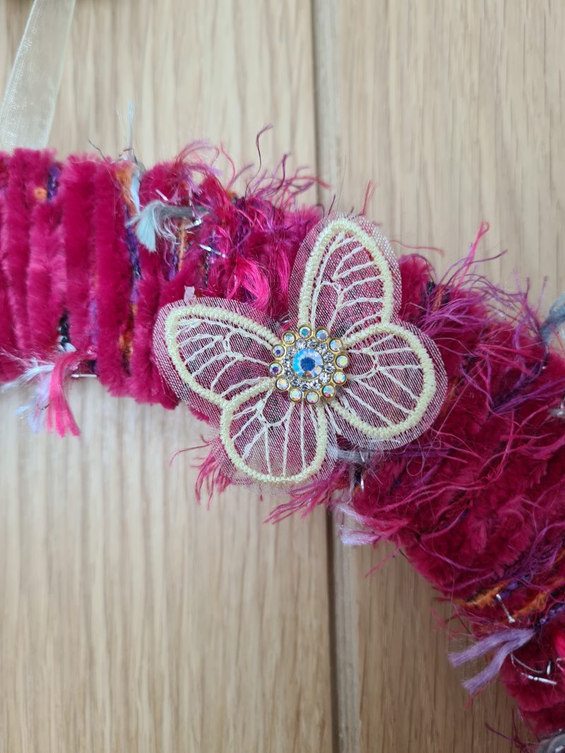 Vibrant pink yarn wrapped wreath
