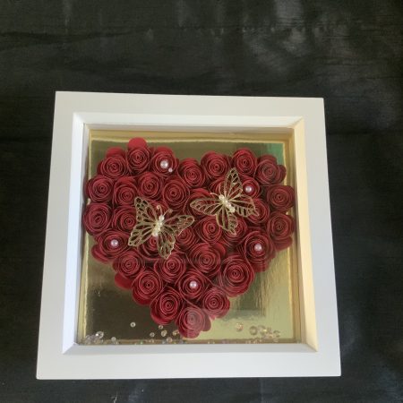 Small red paper flower heart