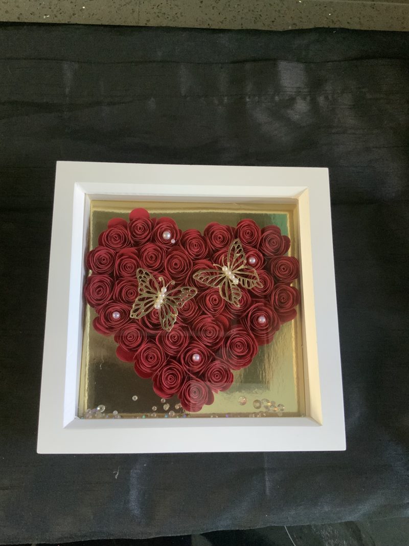 Small red paper flower heart