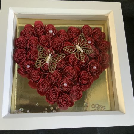 Small red paper flower heart