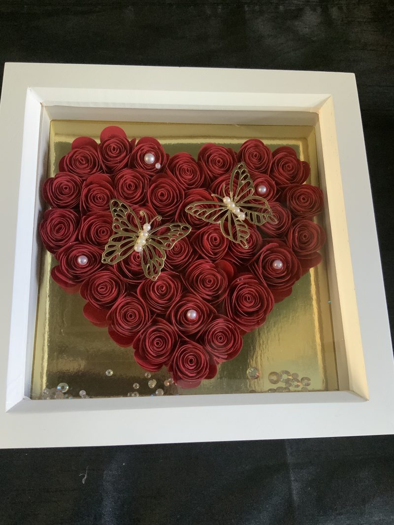 Small red paper flower heart