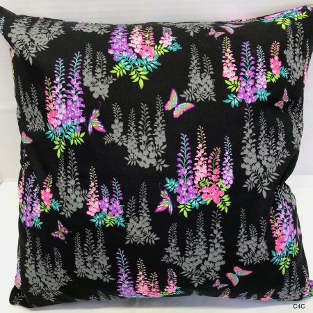 Reverse of black cushion cover with bright pink and purple floral pattern and butterflies, 18 inch square, lined with zip fastening