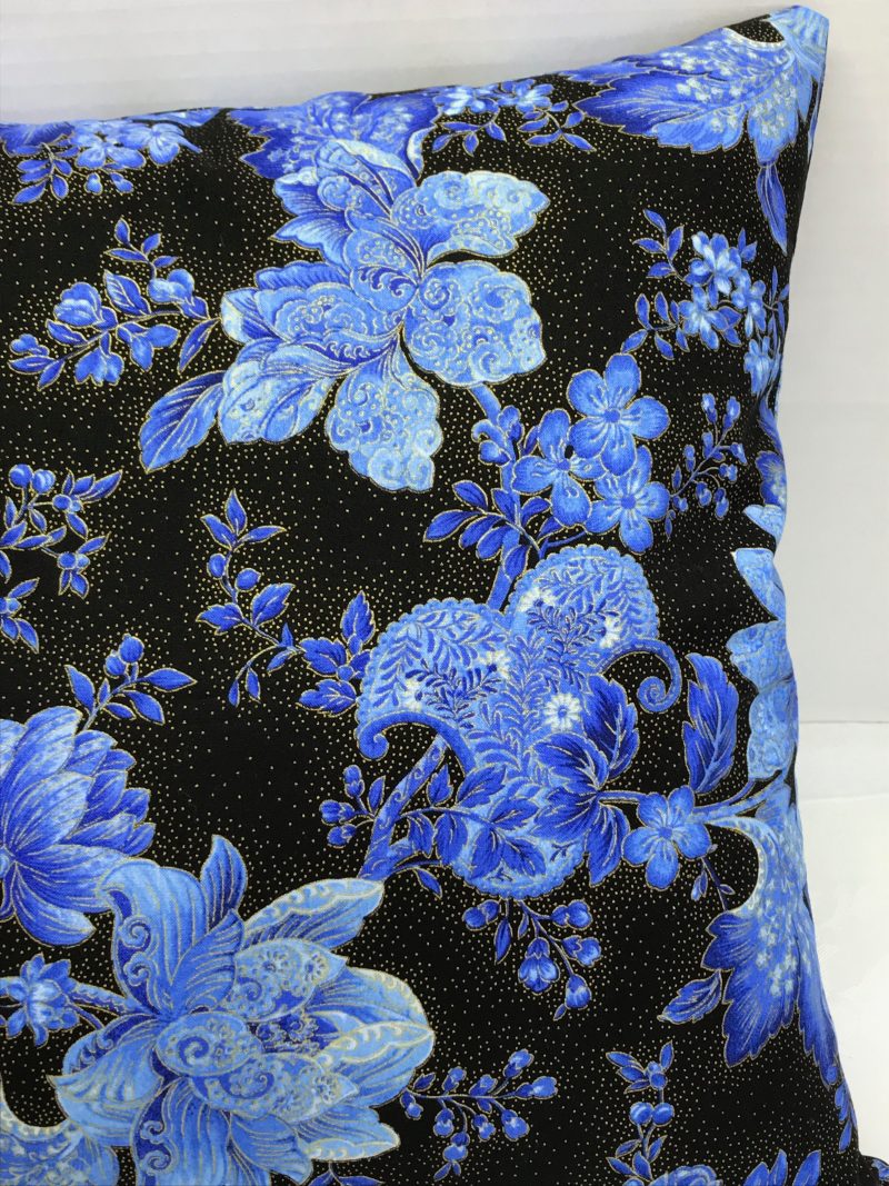 Front detail of blue floral cushion cover with detailed flowers on a black background, 18 inch square, zipped and lined