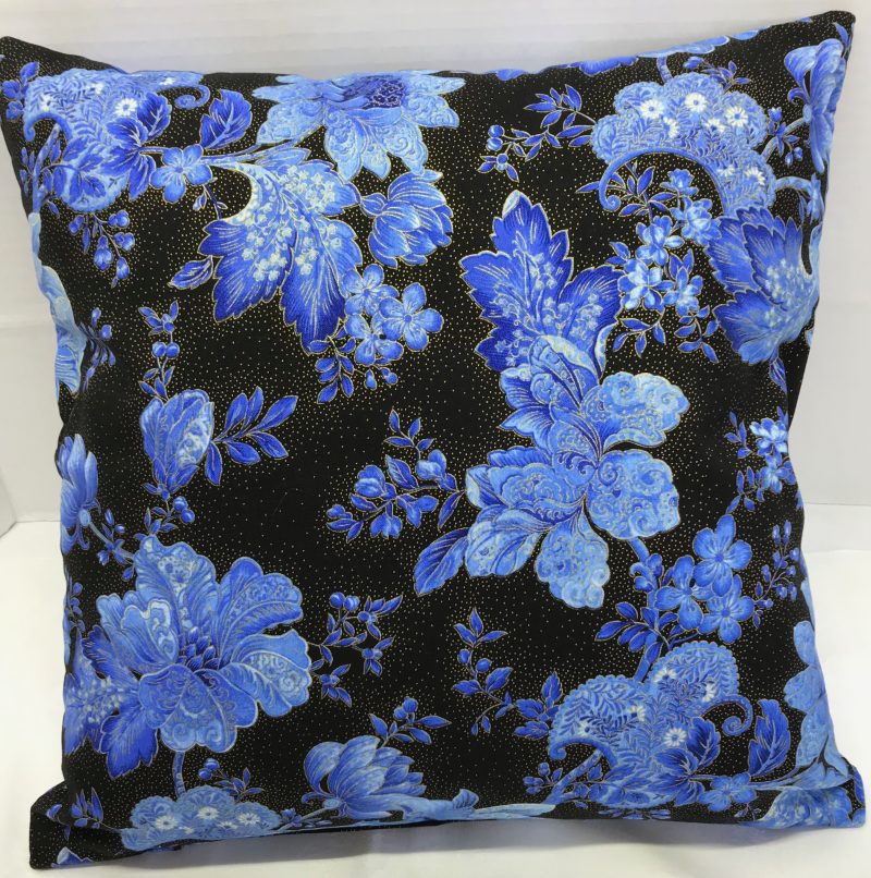 Reverse of blue floral cushion cover with detailed flowers on a black background, 18 inch square, zipped and lined