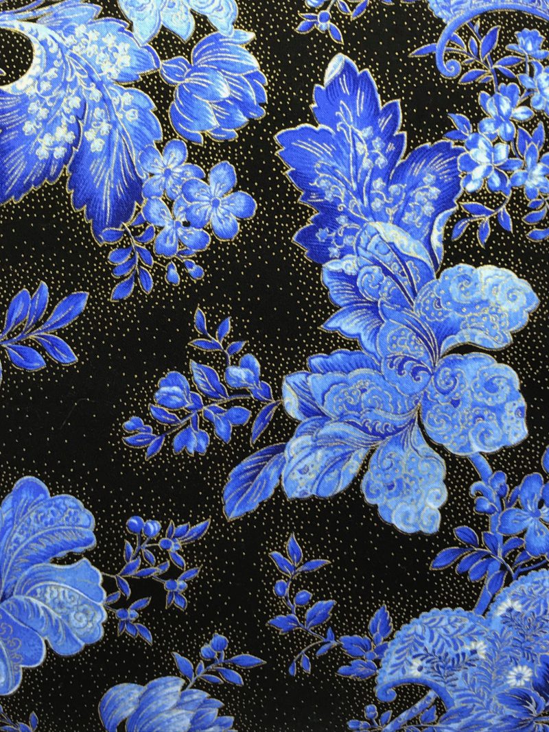 Reverse detail of blue floral cushion cover with detailed flowers on a black background, 18 inch square, zipped and lined