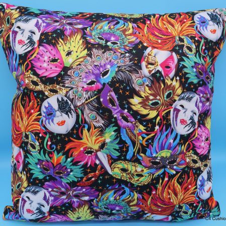Front of colourful cushion cover with vibrant carnival masks and feather design on a black background