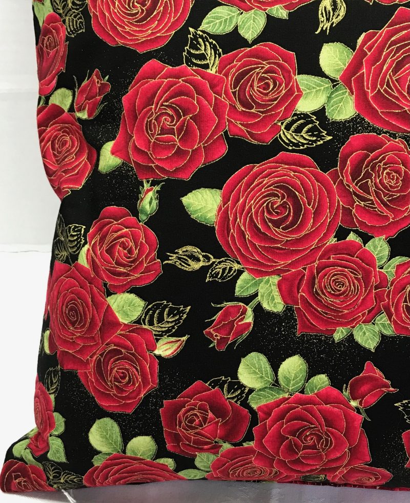 Detail of red rose floral cushion cover with green leaves on a black background, 18 inch 45cm square, zipped and lined decorative pillow case
