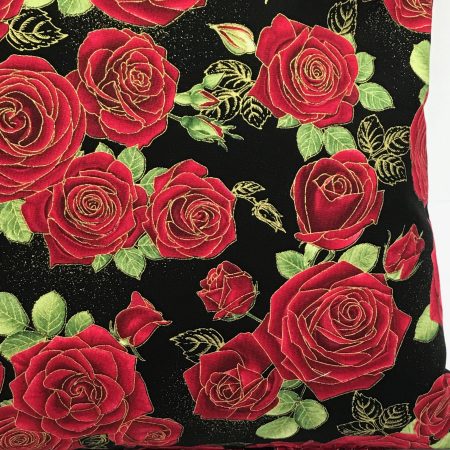 Reverse detail of red rose floral cushion cover with green leaves on a black background, 18 inch 45cm square, zipped and lined decorative pillow case