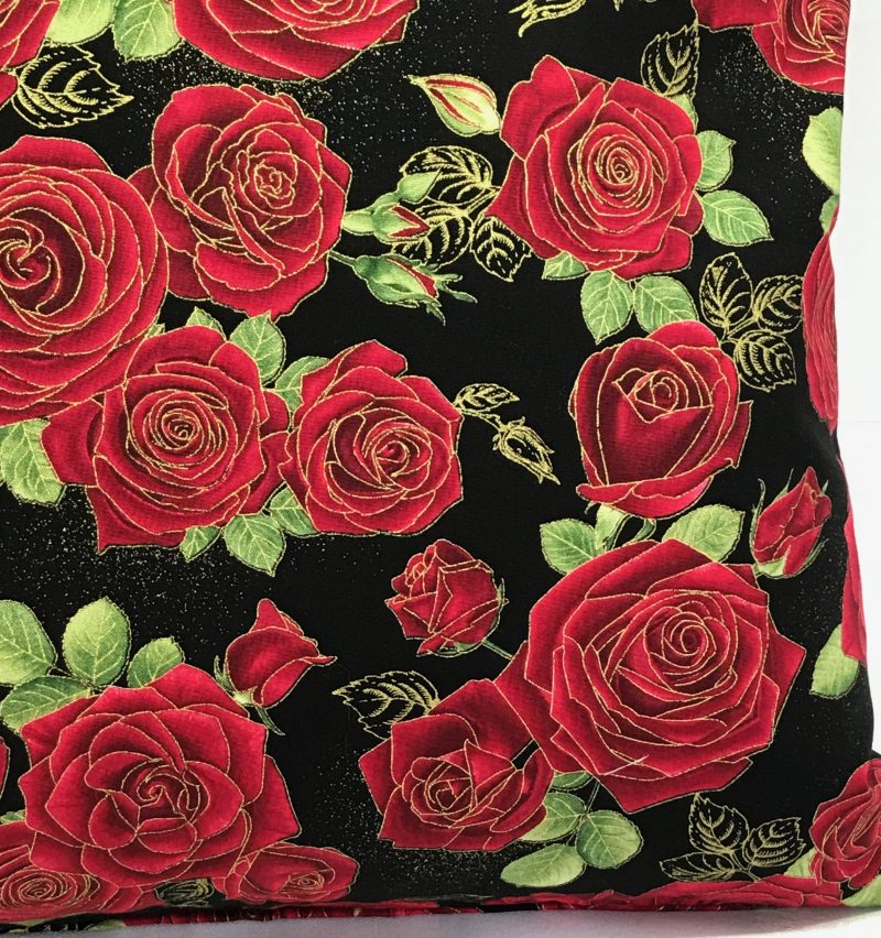 Reverse detail of red rose floral cushion cover with green leaves on a black background, 18 inch 45cm square, zipped and lined decorative pillow case