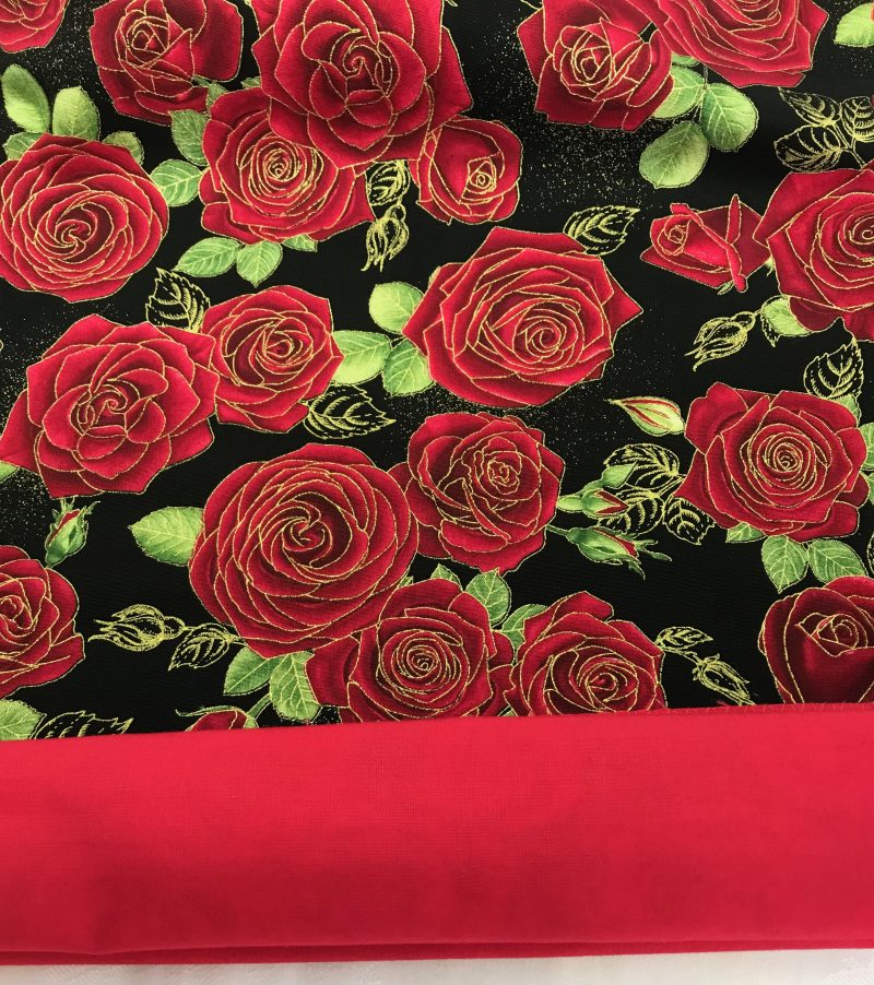 Lining detail of red rose floral cushion cover with green leaves on a black background, 18 inch 45cm square, zipped and lined decorative pillow case