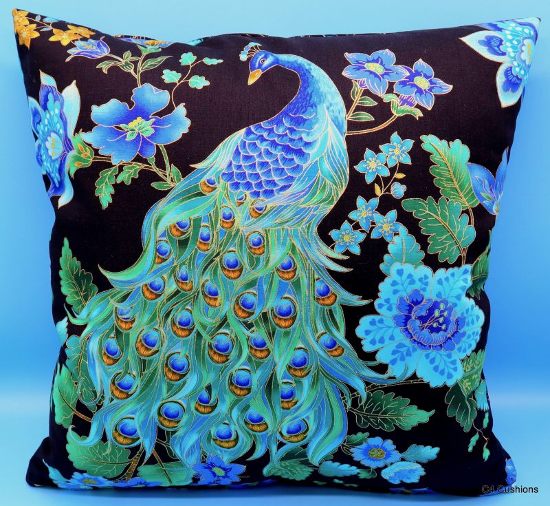 Front of a blue peacock floral cushion cover with vibrant bird design on the front and feather pattern on the reverse