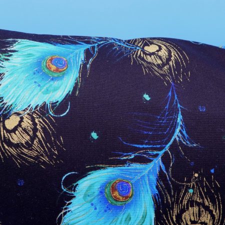 Reverse detail of blue peacock floral cushion cover with vibrant bird design on the front and feather pattern on the reverse