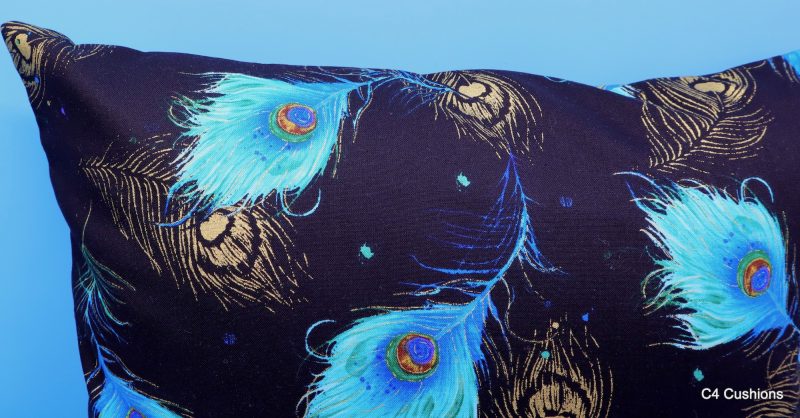 Reverse detail of blue peacock floral cushion cover with vibrant bird design on the front and feather pattern on the reverse