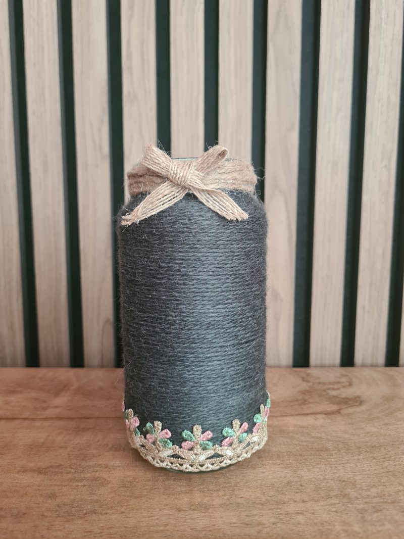 Upcycled glass jar wrapped in dark grey yarn with lace and jute trim