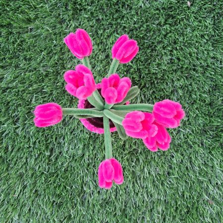 Handmade faux pink tulips crafted from pipe cleaners in a charming pot